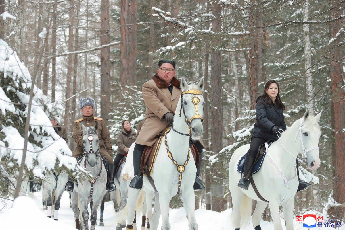 Kim Jong-un riding with his daughter Ju-ae during a visit to Mount Paektu, North Korea, in 2019 (AP)