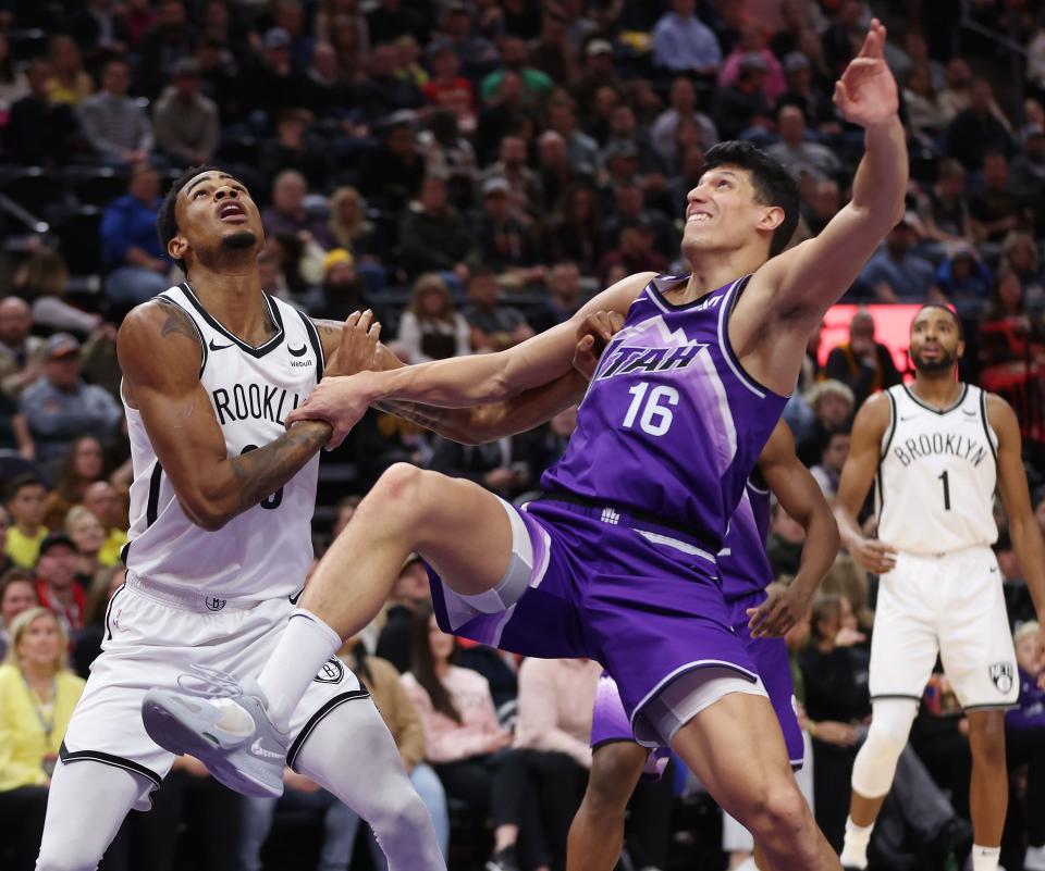 Brooklyn Nets center Nic Claxton (33) and Utah Jazz forward Simone Fontecchio (16) compete to rebound in Salt Lake City on Monday, Dec. 18, 2023. | Jeffrey D. Allred, Deseret News