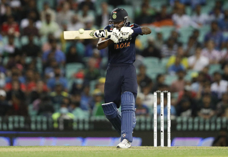 India's Hardik Pandya hits the ball for four runs during the one day international cricket match between India and Australia at the Sydney Cricket Ground in Sydney, Australia, Friday, Nov. 27, 2020. (AP Photo/Rick Rycroft)