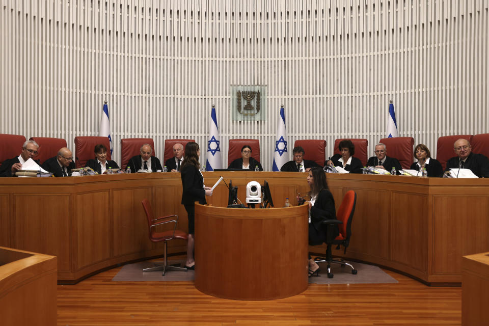 President of the Israeli Supreme Court Esther Hayut, center, and judges assemble to hear petitions against a law that would make it harder to remove a sitting prime minister at the court premises in Jerusalem, Thursday, Sept. 28, 2023. (Menahem Kahana/Pool Photo via AP)