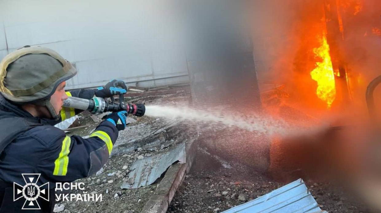 A firefighter putting out a fire. Stock photo: State Emergency Service of Ukraine