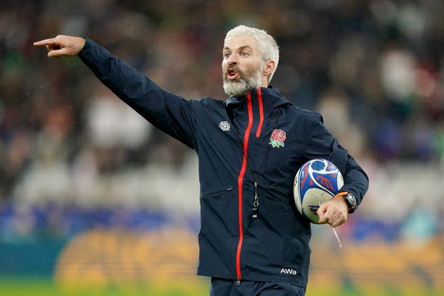 Aled Walters points as he gives instructions during an England training session