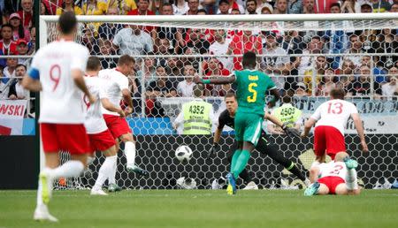 Soccer Football - World Cup - Group H - Poland vs Senegal - Spartak Stadium, Moscow, Russia - June 19, 2018 Poland's Thiago Cionek scores an own goal and the first goal for Senegal REUTERS/Grigory Dukor