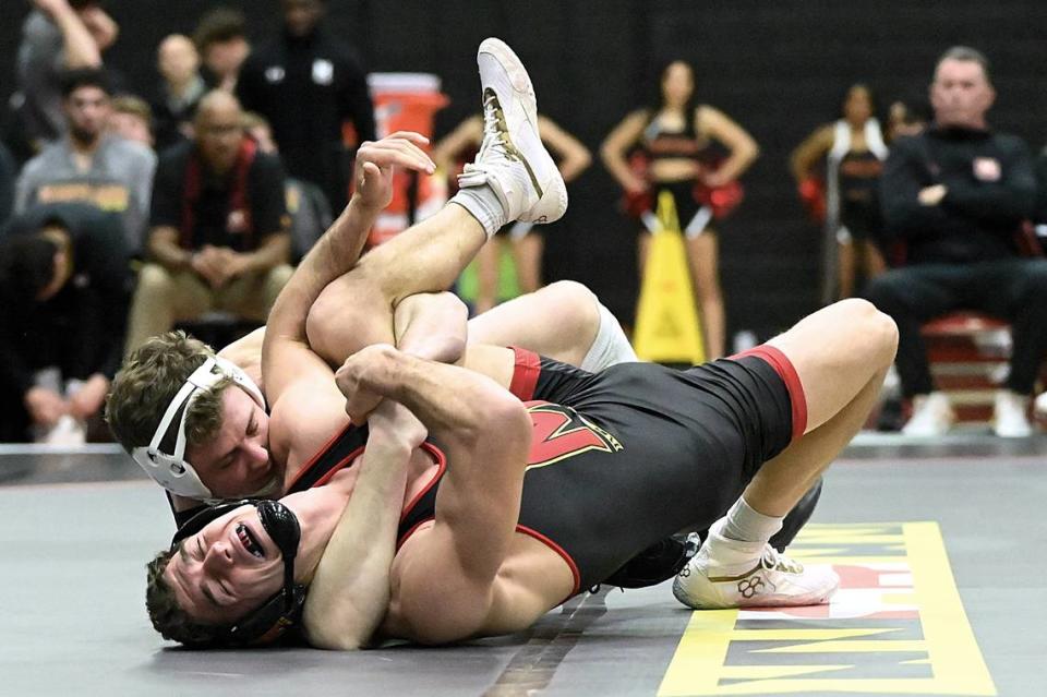 Penn State’s Bernie Truax aims to pin Maryland’s Chase Mielnik in their 184-pound bout of the Nittany Lions’ 42-6 on Jan. 28. Truax did pin Mielnik in 1:43 Jennie Tate/For the CDT