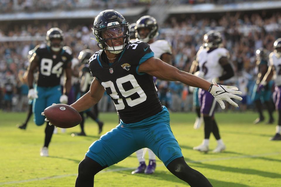 Jacksonville Jaguars wide receiver Jamal Agnew (39) sakes the ball after scoring a touchdown during the fourth quarter of a regular season NFL football matchup Sunday, Nov. 27, 2022 at TIAA Bank Field in Jacksonville. The Jaguars edged the Ravens 28-27. [Corey Perrine/Florida Times-Union]