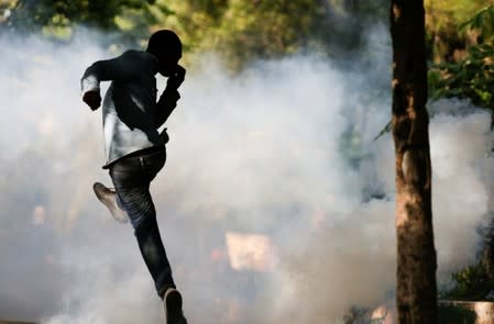 Demonstrators march during a protest to demand the resignation of Haitian president Jovenel Moise, in the streets of Port-au-Prince