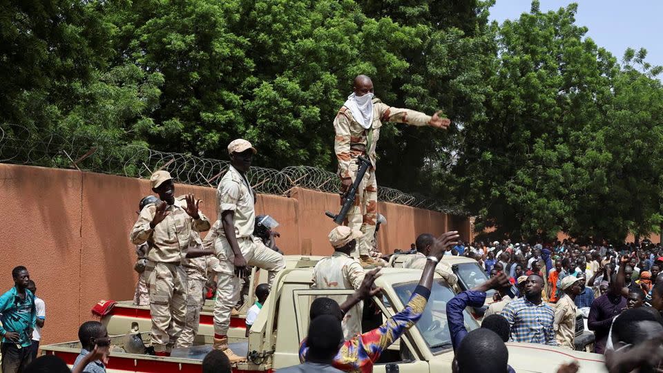 Security forces prepare to disperse pro-junta demonstrators gathered outside the French embassy, in Niamey on July 30, 2023.  - Stringer/Reuters