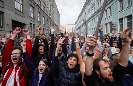 People react at a rally to protest against alleged violations ahead of elections to Moscow City Duma, the capital's regional parliament, in Moscow