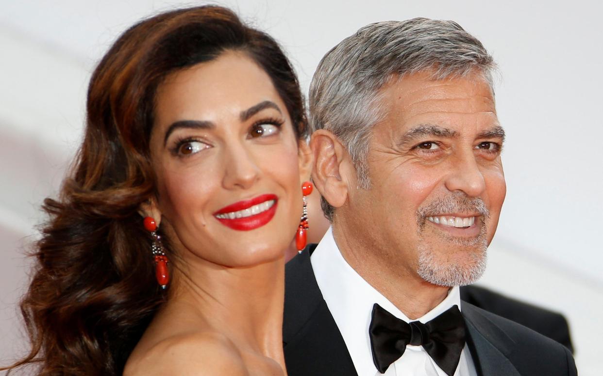 George Clooney and Amal Clooney arriving for the screening of Money Monster during the 69th annual Cannes Film Festival - EPA