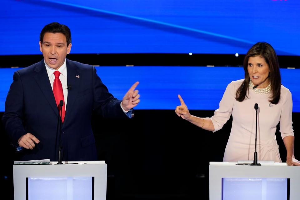 Former UN Ambassador Nikki Haley, right, and Florida Gov. Ron DeSantis, left, both speaking at the at the CNN Republican presidential debate at Drake University in Des Moines, Iowa, Wednesday, Jan. 10, 2024.