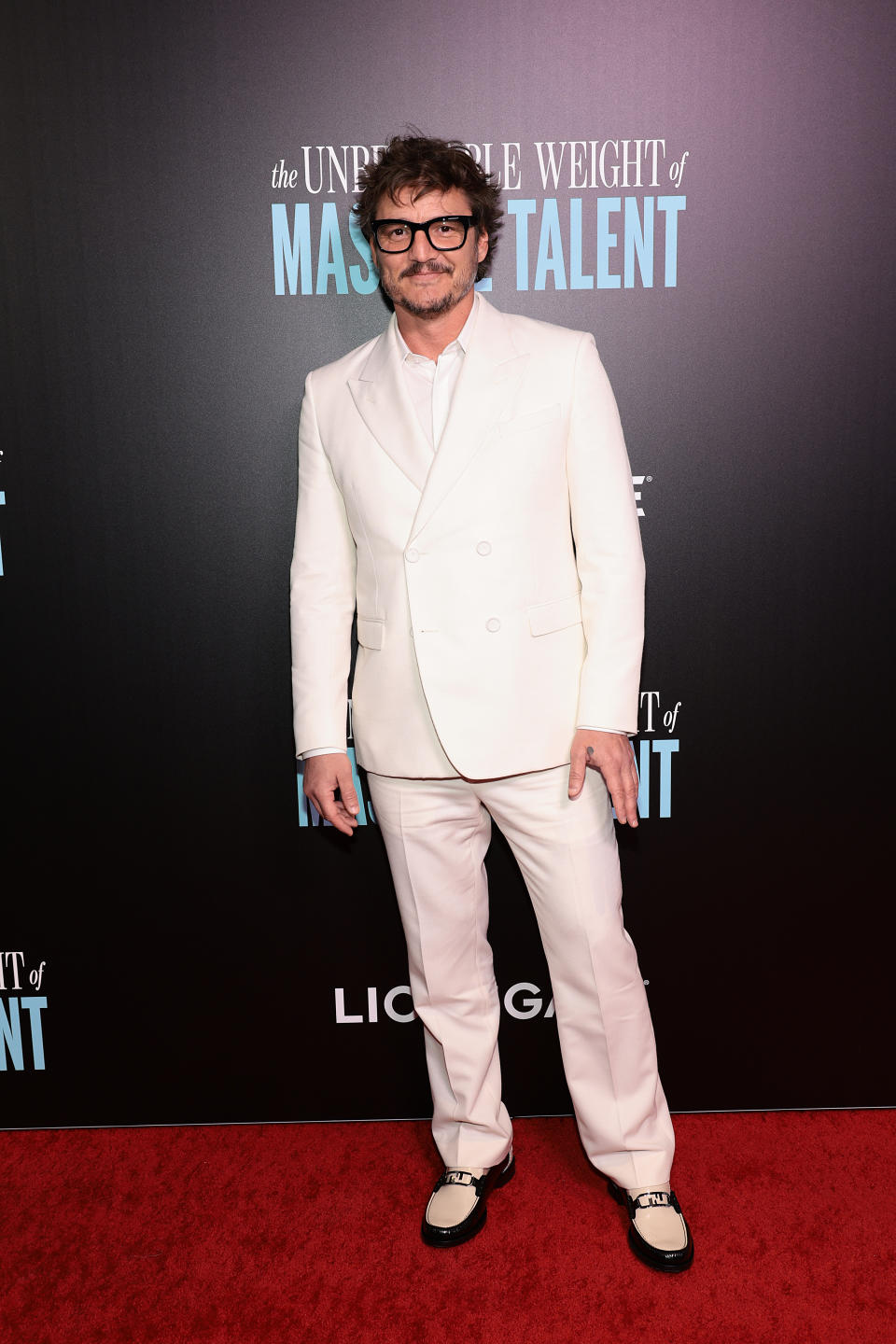 Pedro Pascal, "The Unbearable Weight Of Massive Talent," New York, white suit, loafers, leather, buckles