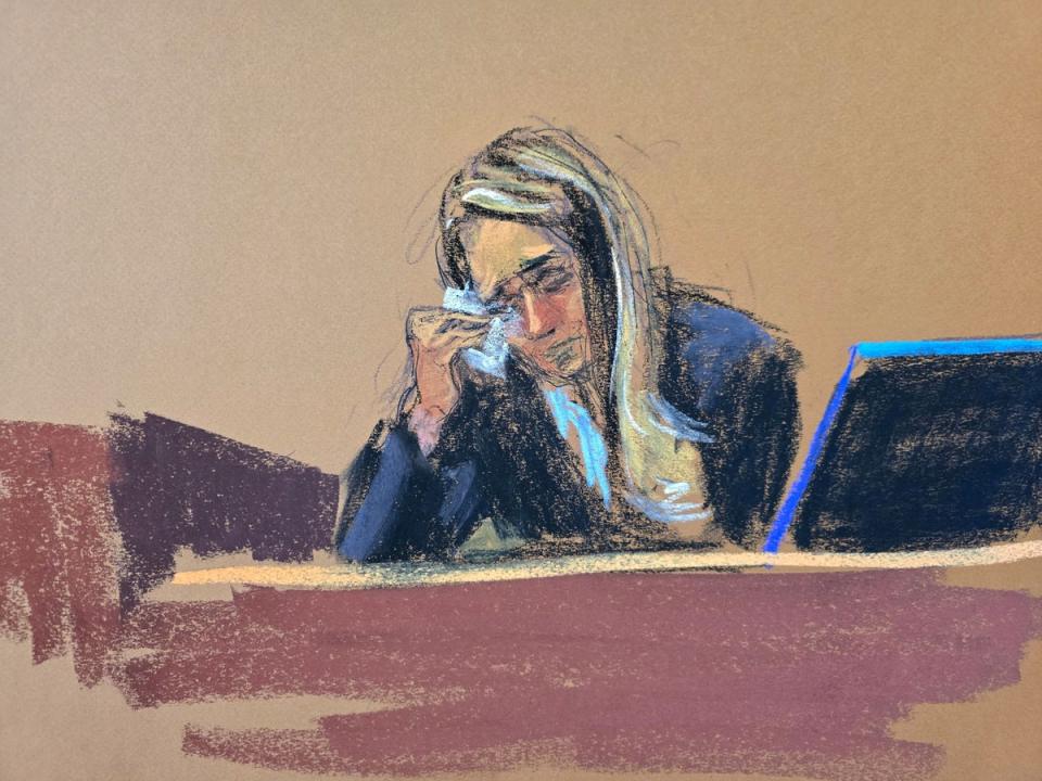 A courtroom sketch captures Hope Hicks isssuing a tissue to dab her eyes during Donald Trump’s criminal trial in Manhattan on 3 May. (REUTERS)