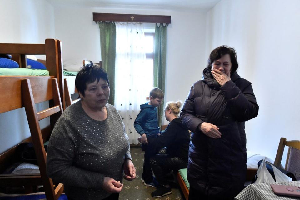 Svetlana, Raisa and Maksim with his mother Anna, in their room at the monastery, after fleeing Ukraine (Reuters)