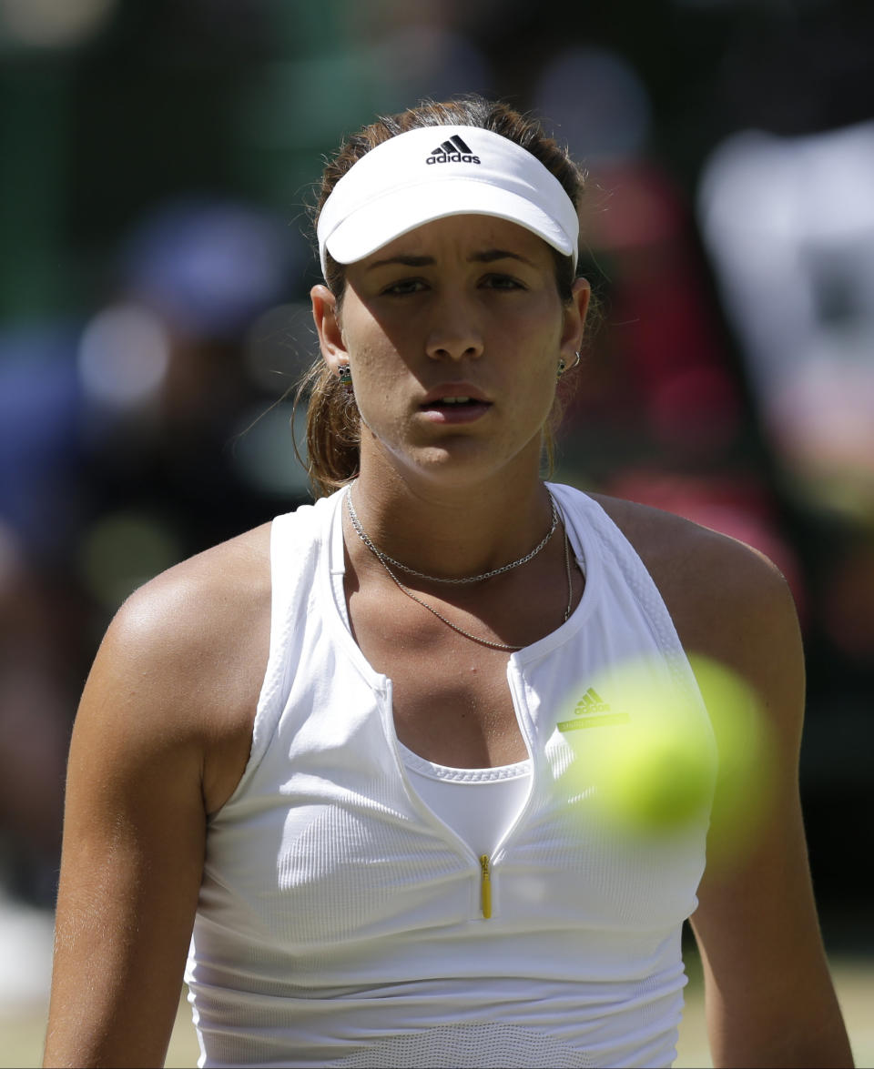 Garbine Muguruza of Spain watches the ball, during the women's singles final against Serena Williams of the United States at the All England Lawn Tennis Championships in Wimbledon, London, Saturday July 11, 2015. (AP Photo/Pavel Golovkin)