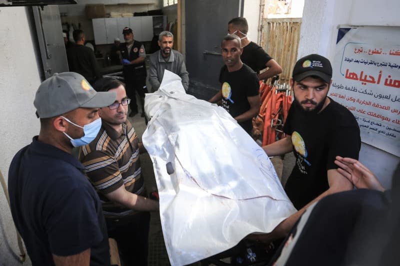 Members of the World Central Kitchen aid group, transport the body of one of the staff members who were killed in an Israeli air strike, out of the morgue of Abu Youssef Al-Najjar Hospital in Rafah in the southern Gaza Strip. Seven employees of the US-based aid organization World Central Kitchen (WCK) were killed in an Israeli airstrike on the Gaza Strip on Monday. Mohammed Talatene/dpa