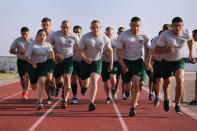 <p>U.S. Border Patrol trainees run during a physical training class at the U.S. Border Patrol Academy on August 3, 2017 in Artesia, N.M. (Photo: John Moore/Getty Images) </p>