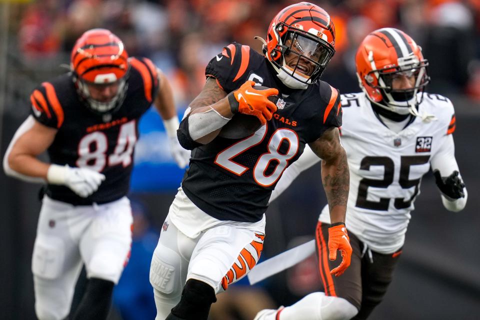 Cincinnati Bengals running back Joe Mixon (28) breaks away on a deep run in the first quarter of the NFL Week 18 game between the Cincinnati Bengals and the Cleveland Browns at Paycor Stadium in downtown Cincinnati on Sunday, Jan. 7, 2024.