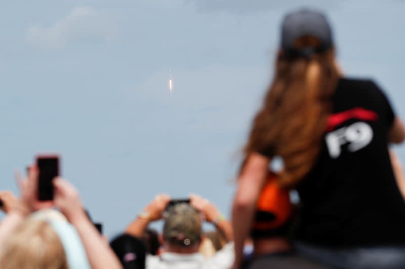 A SpaceX Falcon 9 rocket with the company's Crew Dragon spacecraft onboard lifts off from Kennedy Space Center