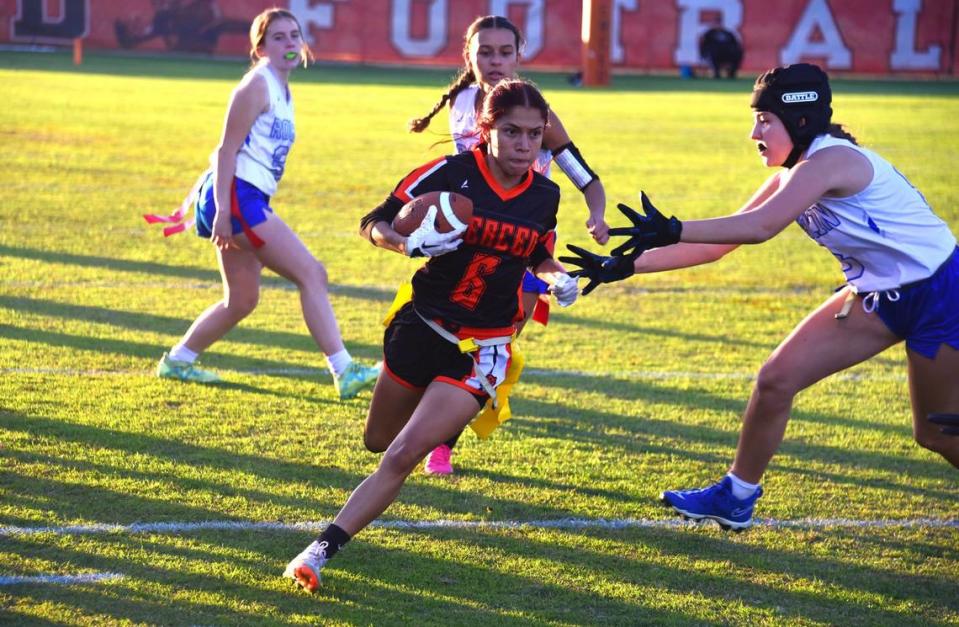 Merced High Schools senior running back Julissa Guzman (6) runs the ball against Rocklin during a playoff game on Thursday, Oct. 26, 2023.