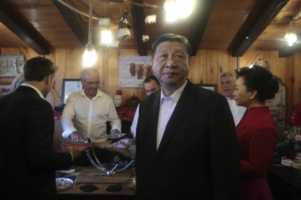 Chinese President Xi Jinping looks on as he, his wife, French President Emmanuel Macron, and Macron’s wife dine at a restaurant at the Tourmalet pass, in the Pyrenees mountains, during his state visit to France on May 7. <br><span class="copyright">Aurelien Morissard—Pool/ AFP/Getty Images</span>