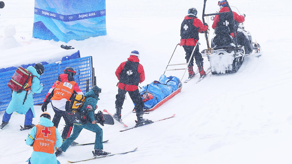 Belle Brockhoff, pictured here being taken from the mountain on a stretcher after crashing during the snowboard mixed team cross.