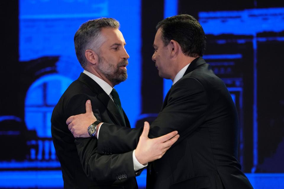 FILE - Socialist Party leader Pedro Nuno Santos, left, and Luis Montenegro, leader of the Social Democratic Party, greet each other before an election TV debate in Lisbon, Portugal, Feb. 19, 2024. The center-left Socialist Party and center-right Social Democratic Party have alternated in power for decades. But they are unsure of how much support they might need from smaller rival parties to form a government after the March 10 vote. (AP Photo/Armando Franca, File)