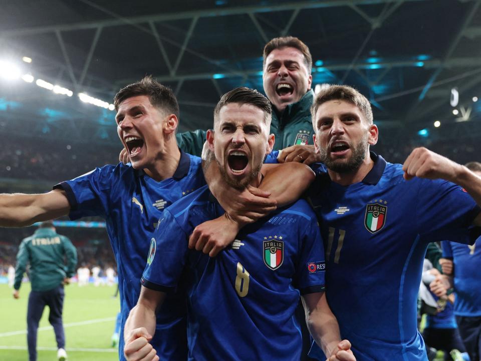 Jorginho celebrates with teammates after scoring in a penalty shootout (Getty)