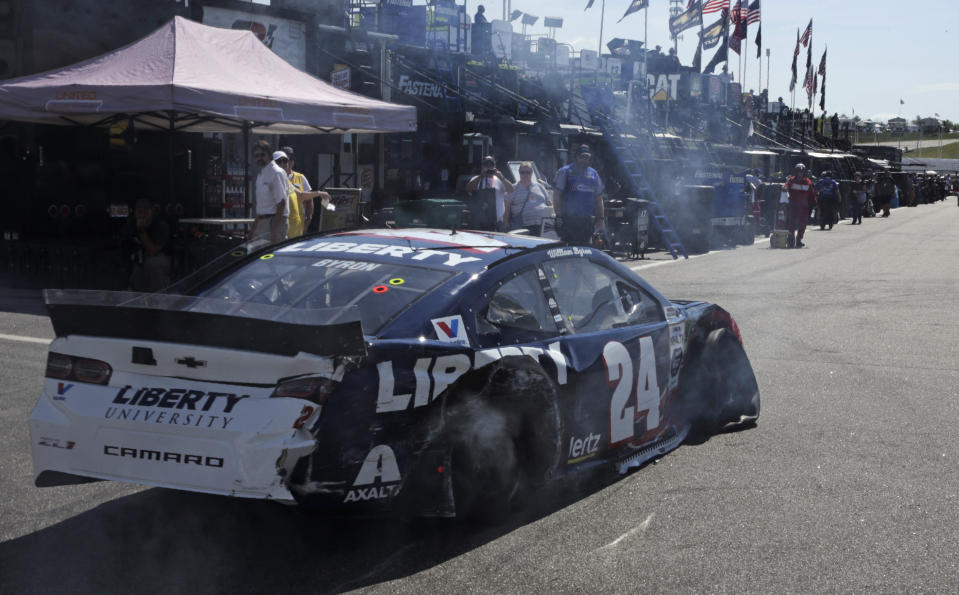 With tires deflated and smoking after a crash, William Byron limps back to the garage during a NASCAR Cup Series auto race practice at New Hampshire Motor Speedway in Loudon, N.H., Saturday, July 20, 2019. (AP Photo/Charles Krupa)