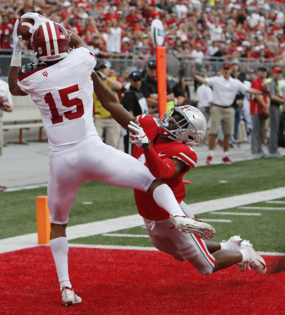 Indiana receiver Nick Westbrook, left, catches a touchdown pass against Ohio State defensive back Jeffrey Okudah during the first half of an NCAA college football game Saturday, Oct. 6, 2018, in Columbus, Ohio. (AP Photo/Jay LaPrete)