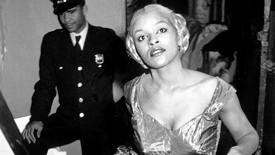 Model Charlotte Stribling aka 'Fabulous' waits backstage for the entrance cue to model clothes designed and made in the Harlem community in 1950. - Eve Arnold/Courtesy Newlands House Gallery