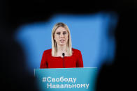 Lyubov Sobol, ally of Russian opposition leader Alexei Navalny, speaks during her news conference via video conference in Moscow, Russia, Tuesday, Jan. 26, 2021. Allies of jailed Russian opposition leader Alexei Navalny are calling for new protests next weekend to demand his release, following a wave of demonstrations across the country in a defiant challenge to President Vladimir Putin. The words on her tribune reading "Free Navalny". (AP Photo/Pavel Golovkin)