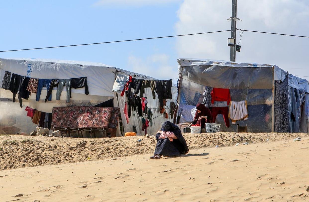 Palestinian families seeking refuge in makeshift tents in vacant areas in Rafah, Gaza Strip. <a href="https://www.gettyimages.com/detail/news-photo/palestinian-families-seeking-refuge-from-israeli-attacks-on-news-photo/1965323426?adppopup=true" rel="nofollow noopener" target="_blank" data-ylk="slk:Abed Rahim Khatib/Anadolu via Getty Images;elm:context_link;itc:0;sec:content-canvas" class="link ">Abed Rahim Khatib/Anadolu via Getty Images</a>