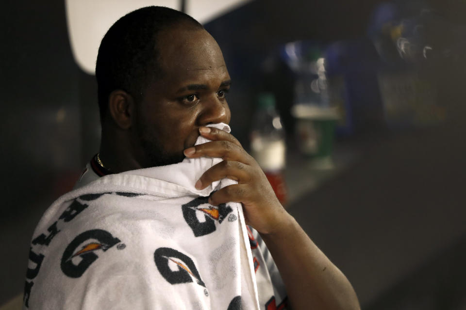 Minnesota Twins starting pitcher Michael Pineda looks out over the field from the dugout during the third inning of the team's baseball game against the Chicago White Sox on Tuesday, Aug. 27, 2019, in Chicago. (AP Photo/Charles Rex Arbogast)