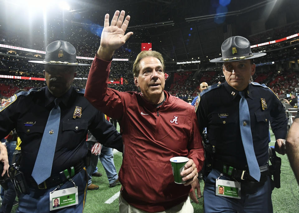 FILE - In this Dec. 1, 2018, file photo, Alabama head coach Nick Saban leaves the field after the Southeastern Conference championship NCAA college football game against Georgia in Atlanta. UCF’s Josh Heupel, Notre Dame’s Brian Kelly and Saban are the finalists for The Associated Press national college football coach of the year after leading their teams to unbeaten regular seasons. The winner will be announced Monday, Dec. 17. (AP Photo/John Amis, File)