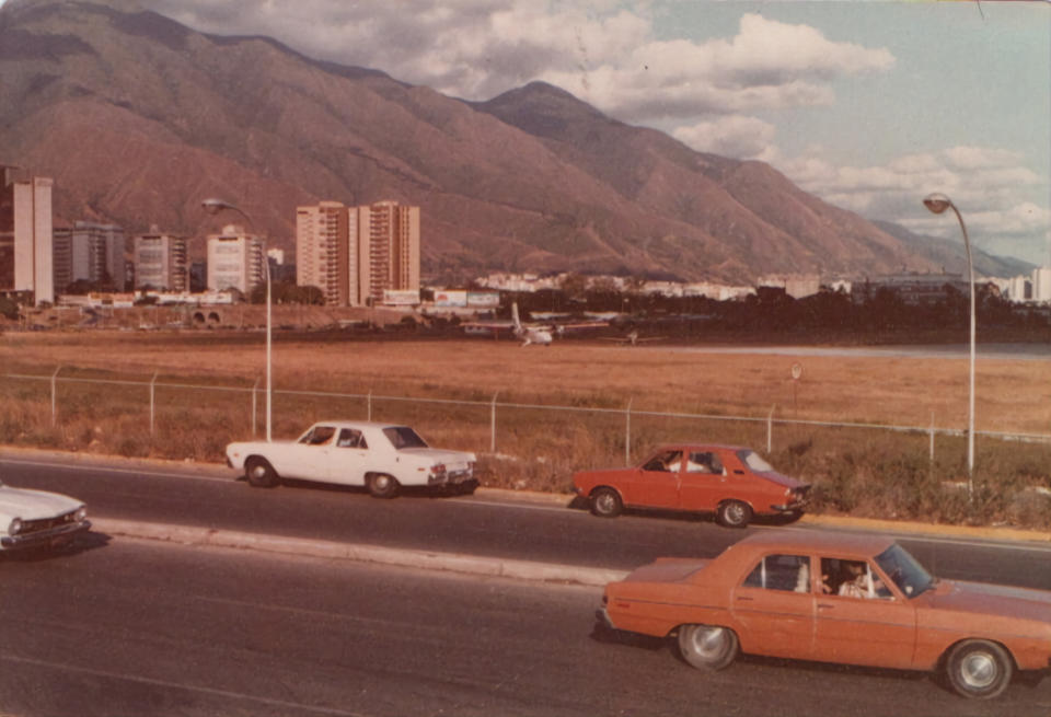 An old photo of a highway is shown