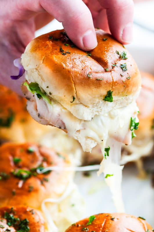 <p>Aberdeen's Kitchen</p><p>Full of cheesy goodness, these turkey swiss cheese melt sliders are literally done in one pan and take 30 minutes from start to finish.</p><p><strong>Get the recipe: <a href="https://www.aberdeenskitchen.com/2017/02/one-pan-turkey-swiss-cheese-melt-sliders/" rel="nofollow noopener" target="_blank" data-ylk="slk:One-Pan Turkey Swiss Cheese Melt Sliders;elm:context_link;itc:0;sec:content-canvas" class="link ">One-Pan Turkey Swiss Cheese Melt Sliders</a></strong></p>