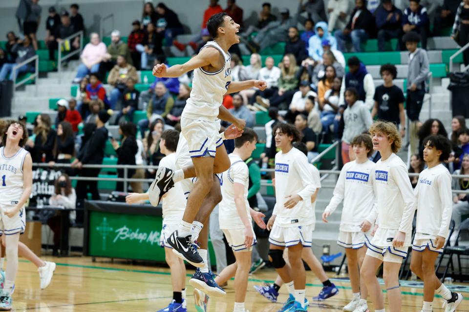 Deer CreekÕs Clyde Davis Jr. celebrates after his team defeated Edmond Santa Fe during the McGuinness Classic boys tournament championship basketball game at Bishop McGuinness high school in Oklahoma City, Saturday, Jan. 7, 2023.