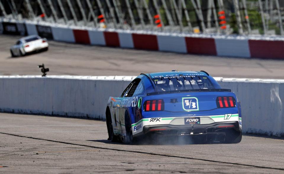 Chris Buescher drives down pit road with a flat tire after he was contacted by Tyler Reddick while leading in the closing laps at Darlington on Sunday.