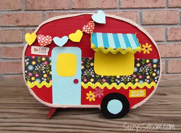 <p>We're crazy for campers, which is why this creative valentine box idea consisting of decoupaged cardboard cutouts caught our eye. </p><p><strong>Get the tutorial at <a href="https://suzyssitcom.com/2015/02/create-a-happy-camper-valentine-card-box.html" rel="nofollow noopener" target="_blank" data-ylk="slk:Suzy’s Artsy-Craftsy Sitcom;elm:context_link;itc:0" class="link ">Suzy’s Artsy-Craftsy Sitcom</a>.</strong> </p>