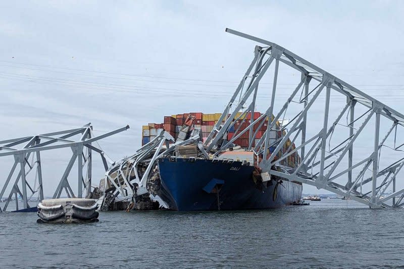 U.S. Army Corps of Engineers staff onboard Hydrographic Survey Vessel CATLETT observe the damage resulting from the Francis Scott Key Bridge collapse in Baltimore, Maryland, on Tuesday. A recovery search for six missing construction workers presumed dead resumed Wednesday morning. Photo by David Adams/U.S. Army Corps of Engineers/UPI