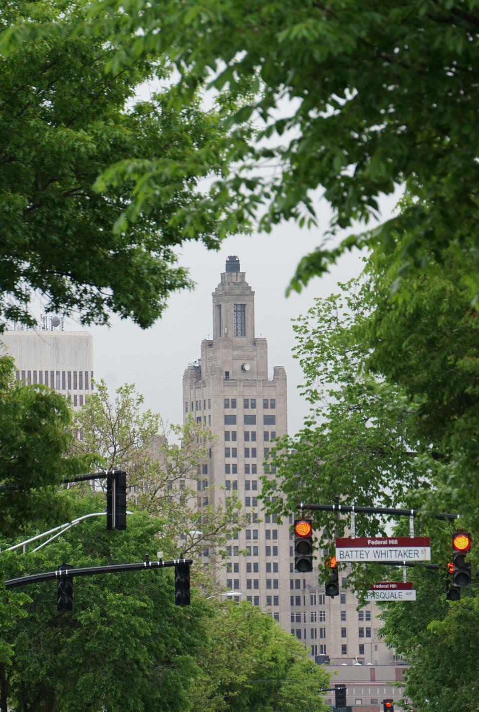 Trees along Broadway frame the Industrial Trust building in Providence.