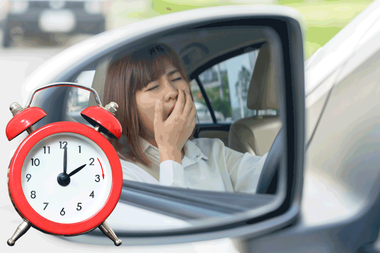 A woman yawning in a car with the filename \