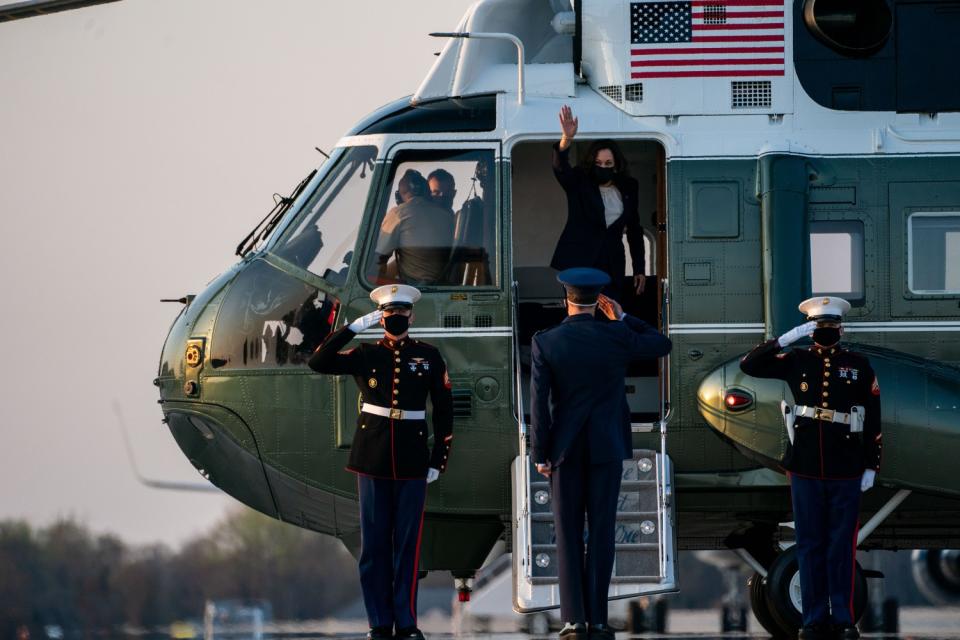 Vice President Kamala Harris waves from a plane