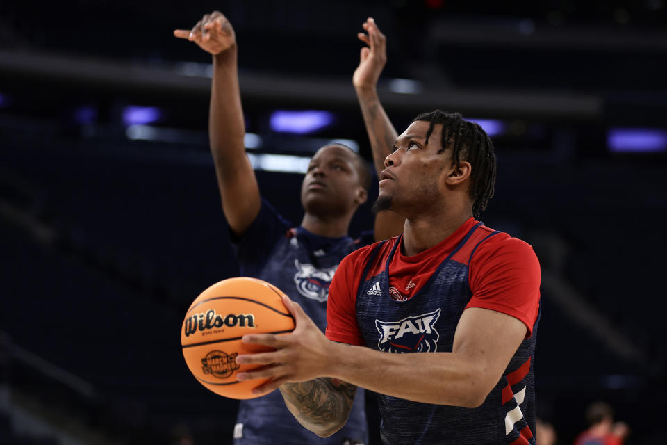 Florida Atlantic guard Alijah Martin shoots in front of Johnell Davis during practice before a Sweet 16 college basketball game at the NCAA East Regional of the NCAA Tournament, Wednesday, March 22, 2023, in New York. (AP Photo/Adam Hunger)