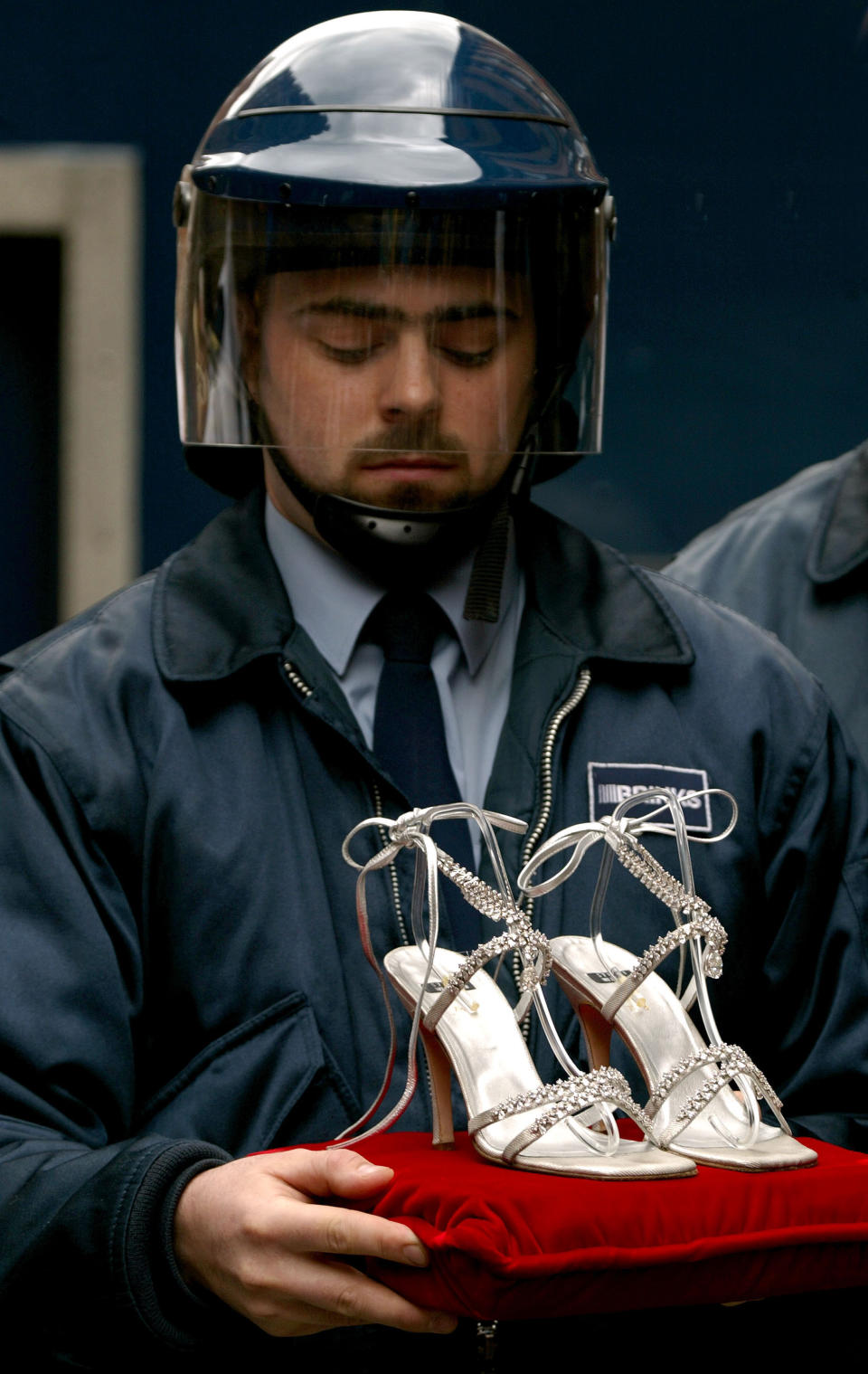 404600 05: A secutiry guard watched over a pair of Stuart Weitzman $1M diamond and platinum shoes April 29, 2002 in London. The shoes, worn by model Laura Elena Harring at this year's Oscars, are covered with 464 diamonds and are the most expensive shoes in the world. The shoes are going on sale at Harrod's department store and the proceeds will go to childrens'' charities. (Photo by Sion Touhig/Getty Images)