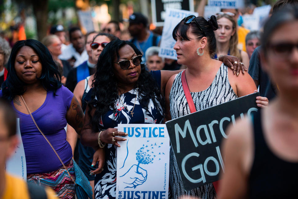 <p>Valerie Castile, center, mother of Philando Castile who was killed by a police officer last year, marches in memory of Justine Damond on July 20, 2017 in Minneapolis, Minn. (Photo: Stephen Maturen/AFP/Getty Images) </p>