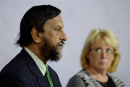 Intergovernmental Panel on Climate Change (IPCC) Chairman Rajendra Pachauri (L) comments on the U.N. IPCC Climate Report presentation during a news conference in Stockholm, September 27, 2013. REUTERS/Jessica Gow/TT News Agency