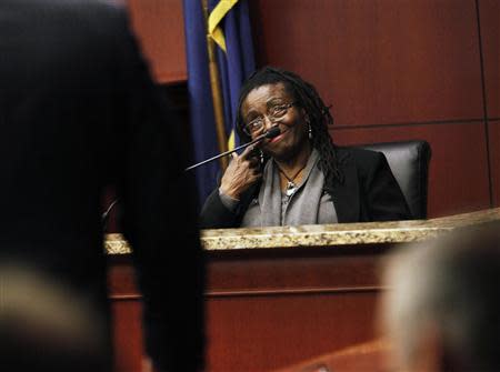 Defense witness Katherine Stinney-Robinson tries to remember a fact during her testimony with defense lawyer Steven McKenzie at the hearing to reopen the case for her brother George Stinney Jr. in Sumter, South Carolina January 21, 2014. REUTERS/Randall Hill