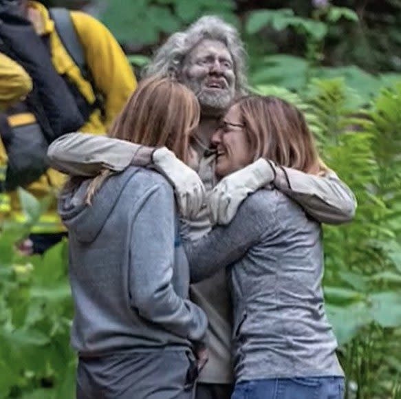 McClish hugs his family after being rescued