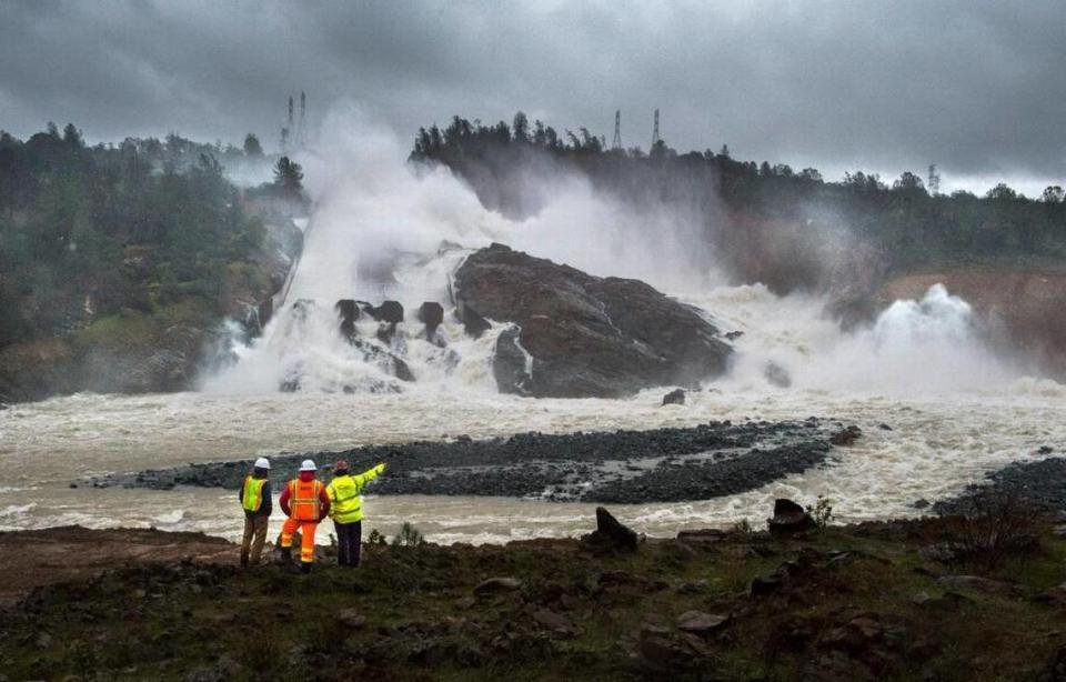 To keep the emergency spillway from crumbling, DWR dramatically ramped up water releases on the battered main spillway, bringing lake levels down and effectively ending the crisis. Water continued pounding the main spillway for days afterward, carving a giant crevice in the nearby hillside. This photo was taken Feb. 20.